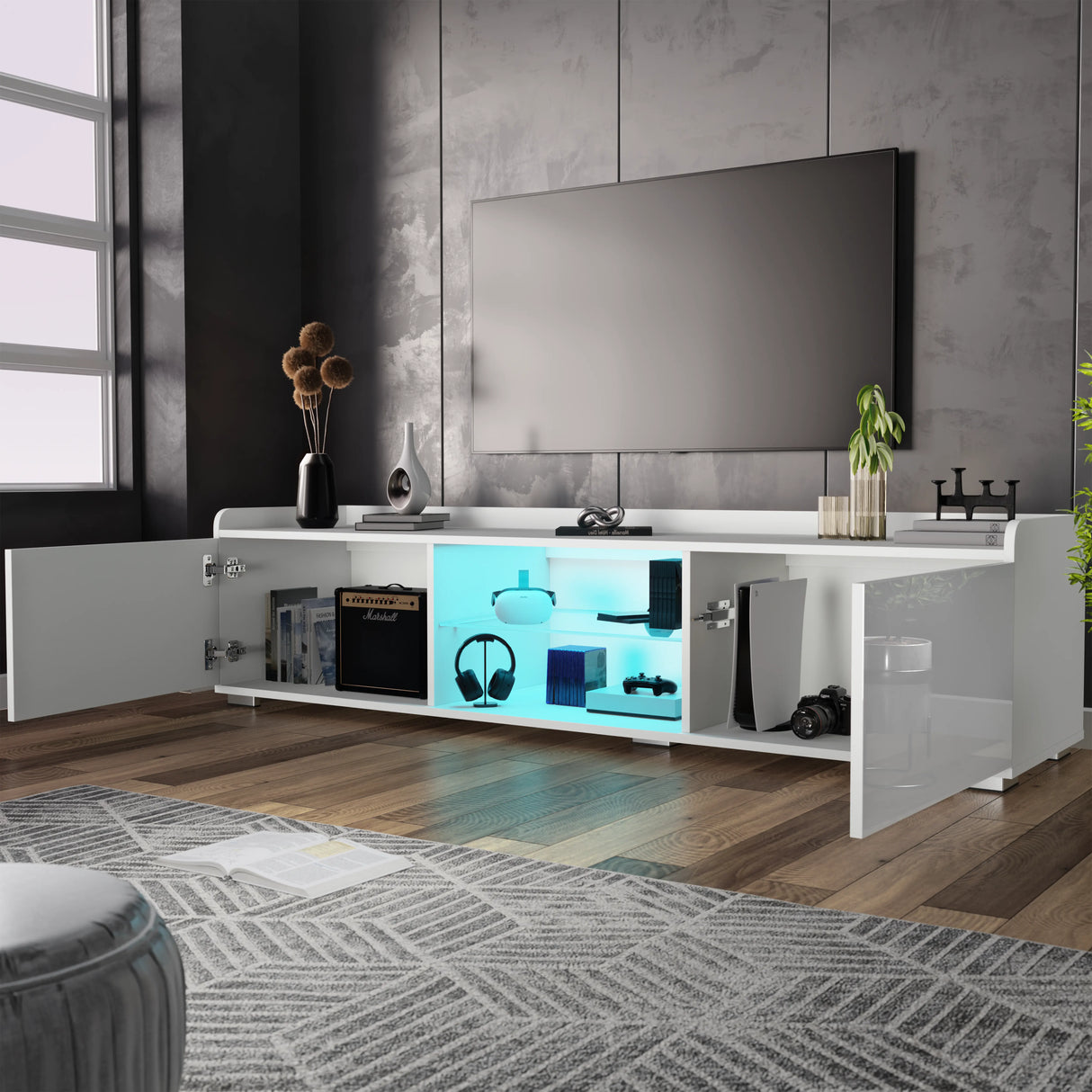 Modern living room with a white entertainment console, TV, and decorative items.
