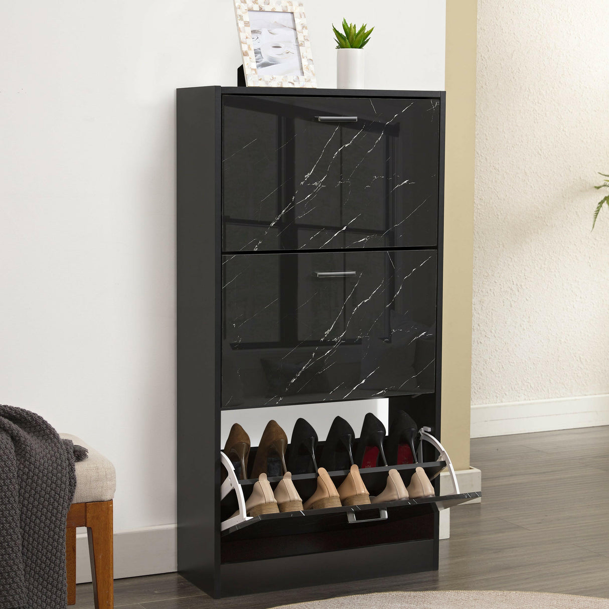 Black marble slim shoe storage cabinet with two drawers and multiple shoe compartments