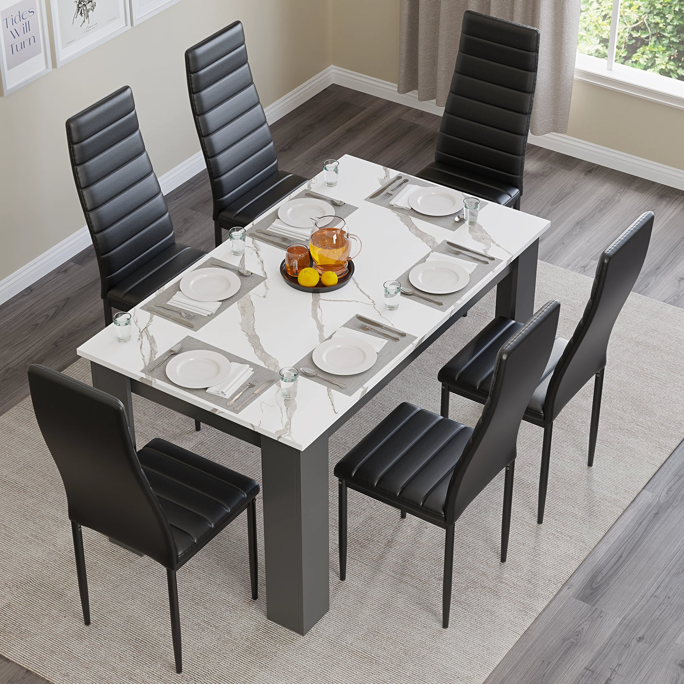 Contemporary 6 seater dining table with black chairs and marble-effect top, set for a meal in a bright room.