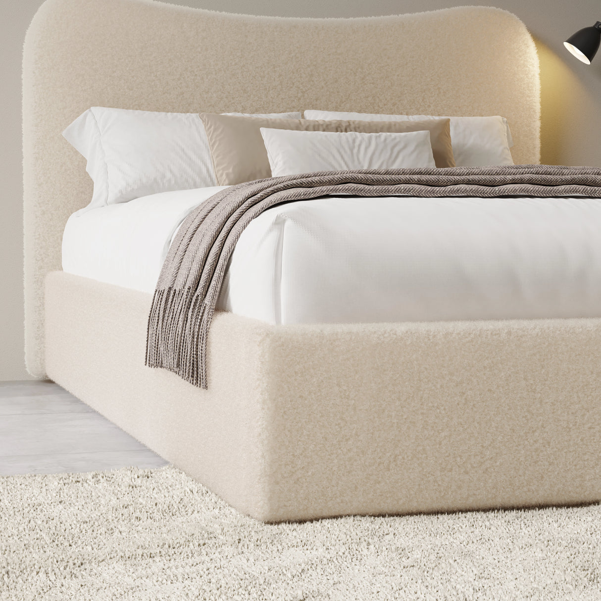 Curved headboard ottoman storage bed in beige boucle fabric with hidden under-bed storage. Stylish platform bed frame ideal for modern bedrooms.