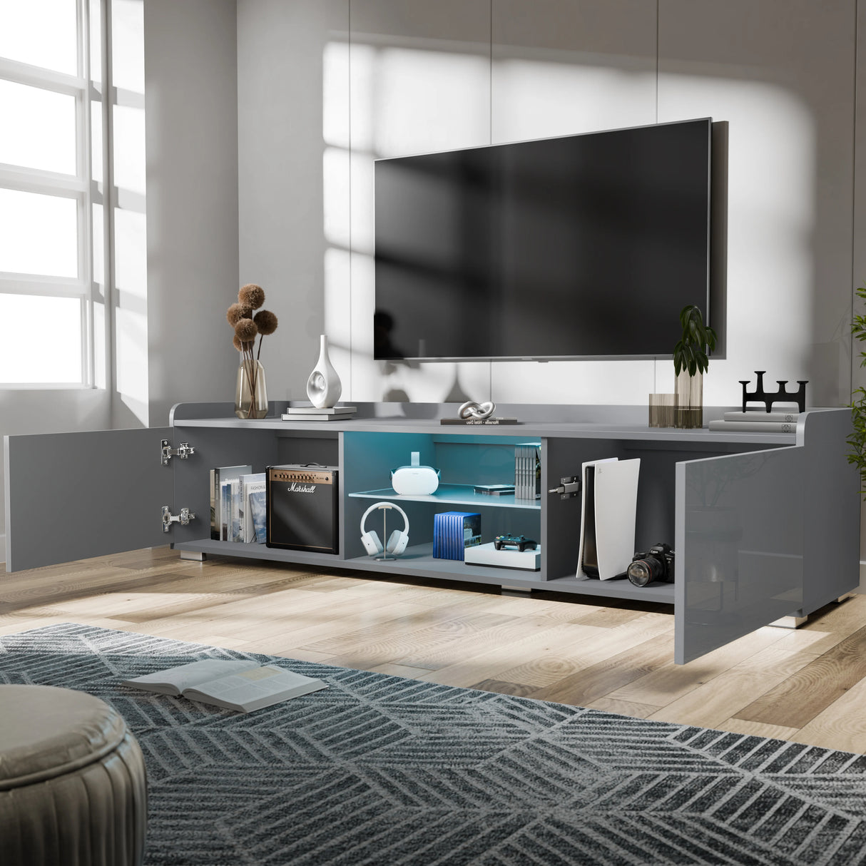 Modern living room with a large TV mounted on the wall above a gray entertainment console.