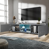 Modern living room with a large TV mounted on the wall above a gray entertainment console.