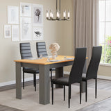 Pine dining table set with grey legs and 4 black padded chairs. Ideal for small family dining.