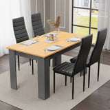 Dining table set of 4 with pine top and grey legs, paired with black padded chairs. Stylish and functional.