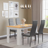 Warm pine dining table with white legs and 4 grey padded chairs. Elegant dining set for contemporary spaces.