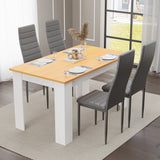 Dining table set of 4 with pine top and white legs, paired with grey padded chairs. Ideal for modern dining rooms.