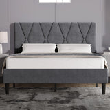 Velvet upholstered bed frame in dark grey with tall adjustable headboard and black wooden legs, ideal for modern bedrooms in king size.