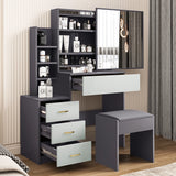 Grey vanity table with light grey drawers, mirror, and stool. Features multiple storage compartments for makeup and accessories.
