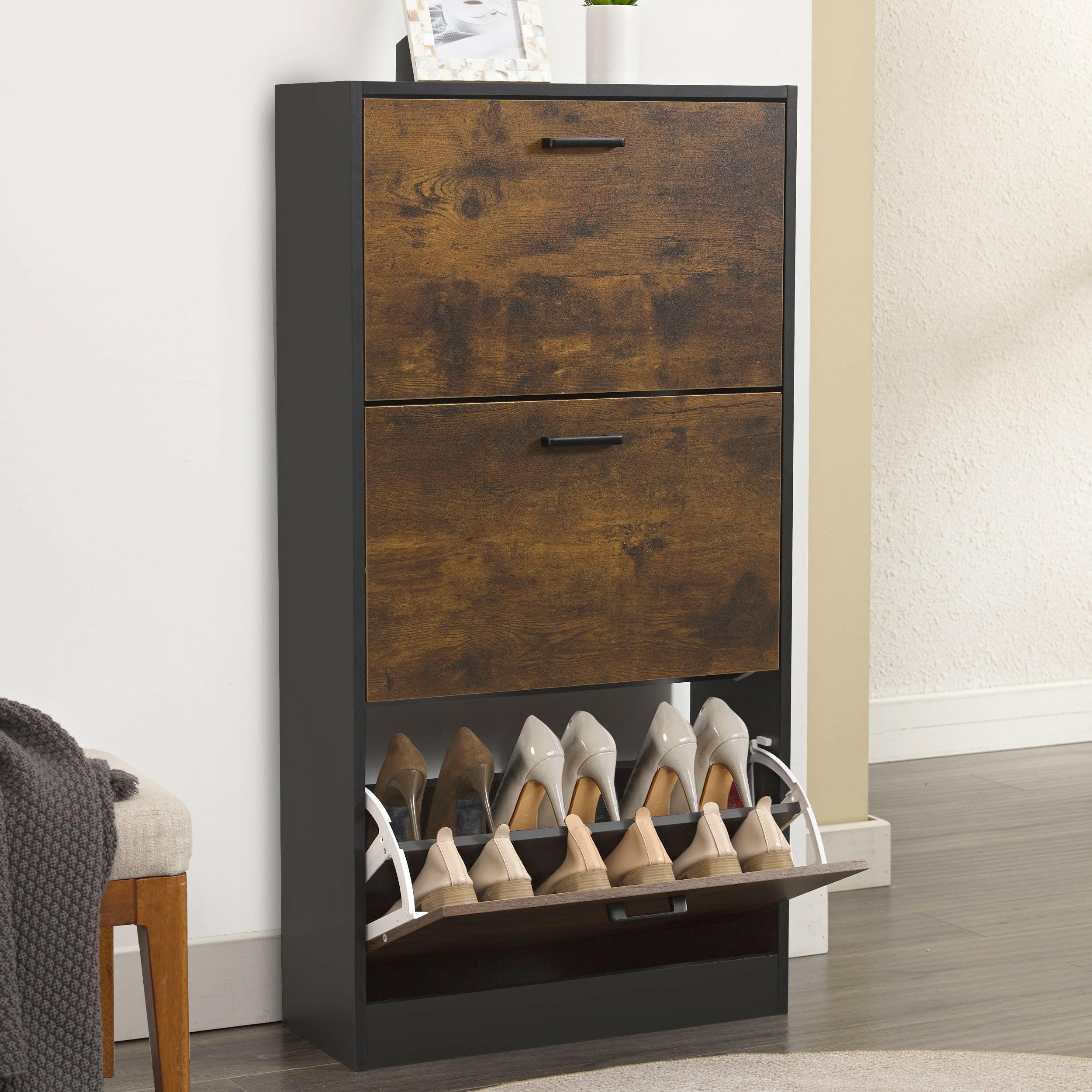 Shoe storage cupboard with black and wooden finish, featuring two compartments and shoe racks