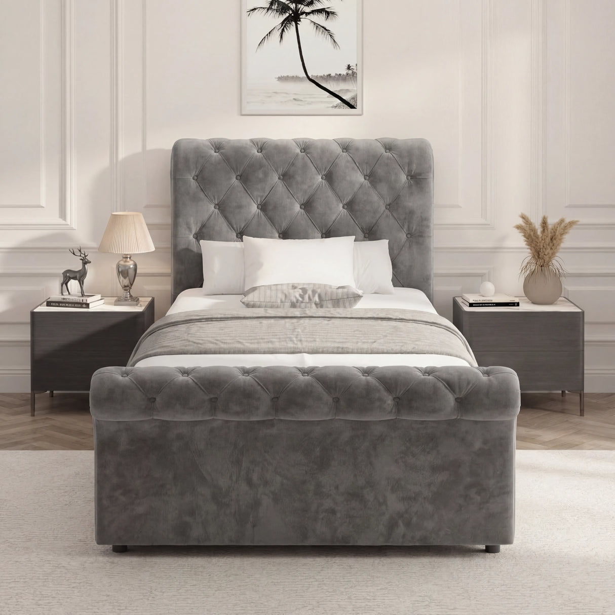 Front view of dark grey Chesterfield Ottoman Bed with plush tufted headboard and footboard, styled in a modern bedroom setting.