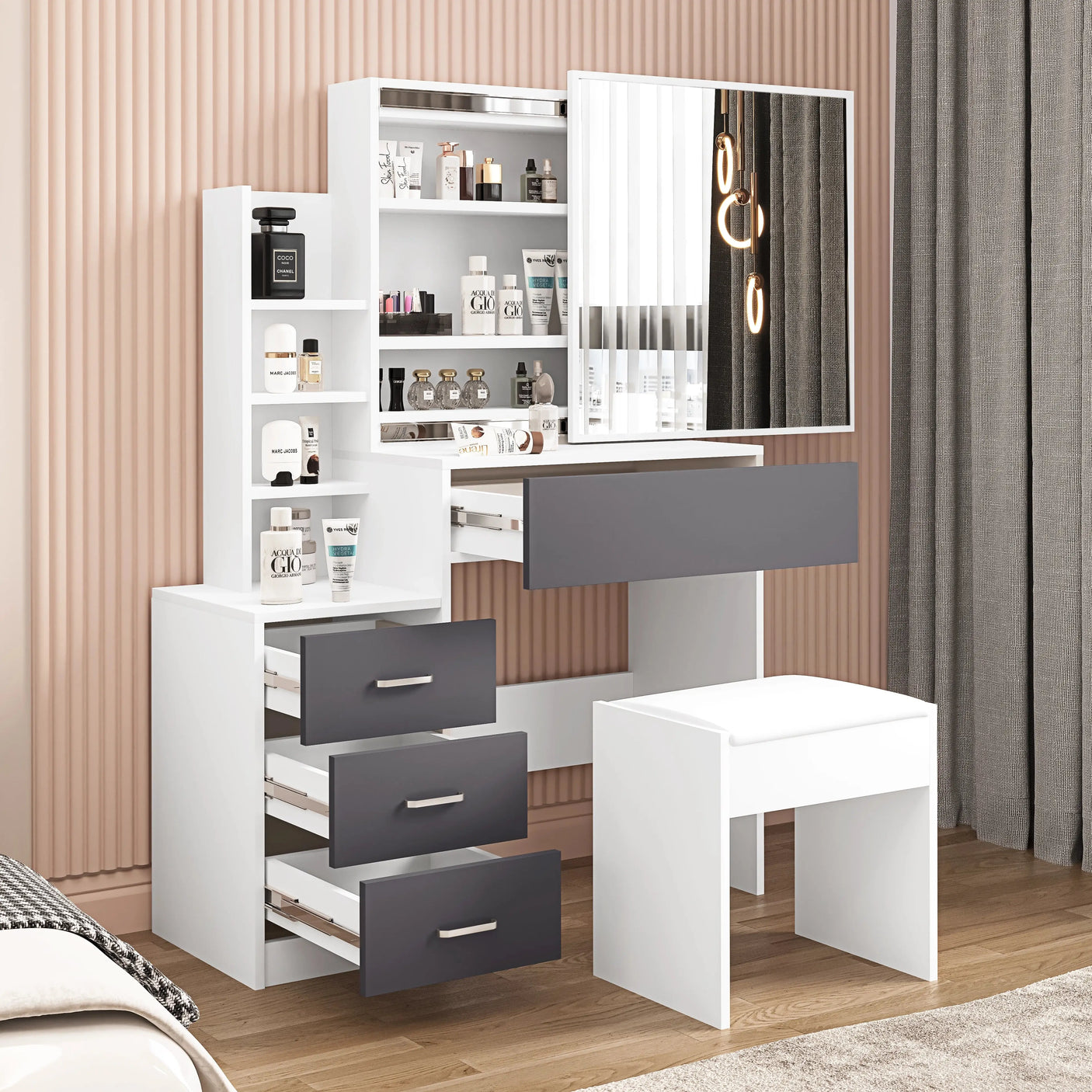 White and grey vanity table with mirror and stool. Features drawers and shelves for organized bedroom makeup storage.