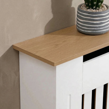 [Small | White] Radiator Cover Small with oak top displayed at an angle in a warm living room