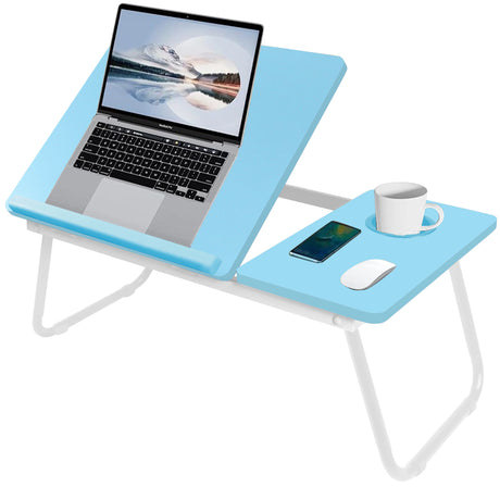 raised blue bed table for laptop holding a laptop and cup, placed on a bed with legs fully extended