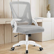 [White + Grey] The grey mesh chair in a home office provides ergonomic seating with a desk in the backdrop to enhance productivity.