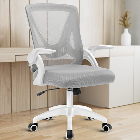The grey mesh chair in a home office provides ergonomic seating with a desk in the backdrop to enhance productivity.