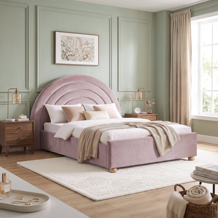 [Pink | King] Wide bedroom view of pink rainbow ottoman bed with curved headboard, rug, side tables and window