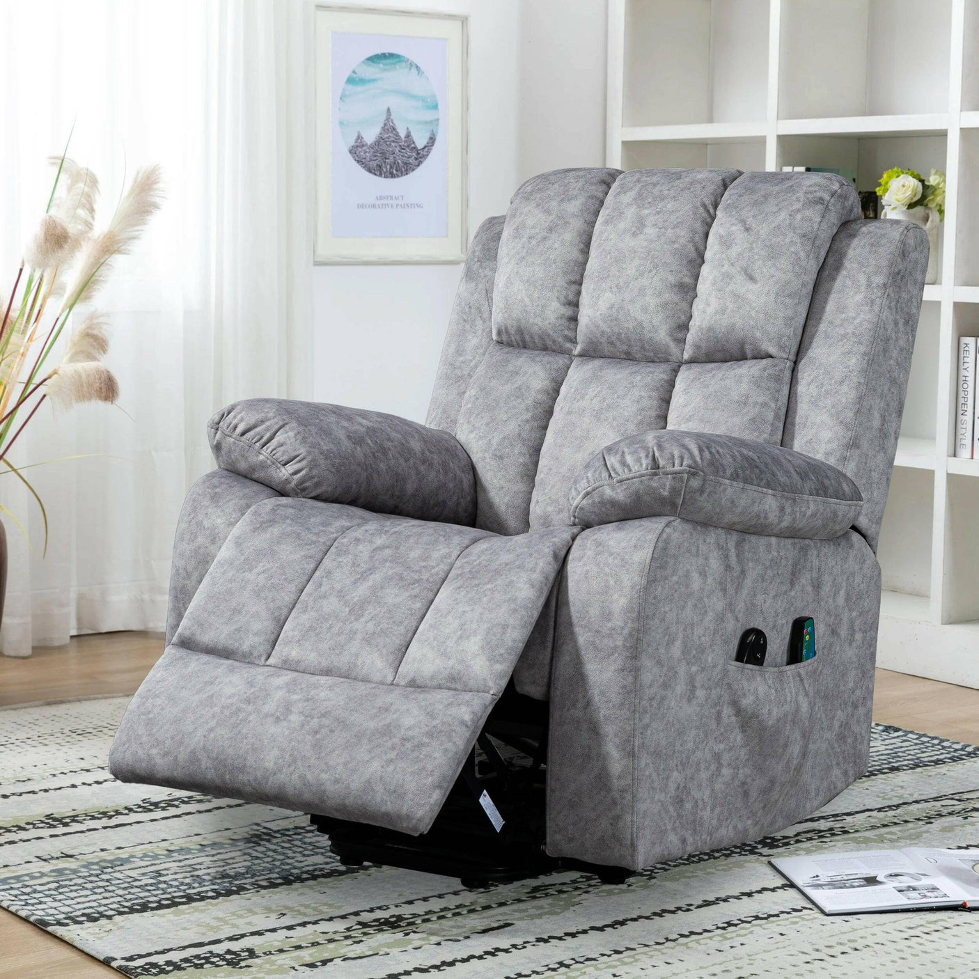 Light grey velvet recliner chair in a cozy room setup, featuring extended footrest and side control panel for massage and lift functions.