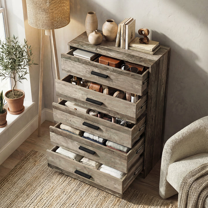 [Ash Grey] five drawer chest shown at angle with drawers open, revealing storage depth and layout