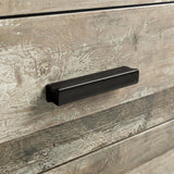 [Ash Grey] Close up of ash grey drawer front with matte black wooden handle and visible wood grain texture