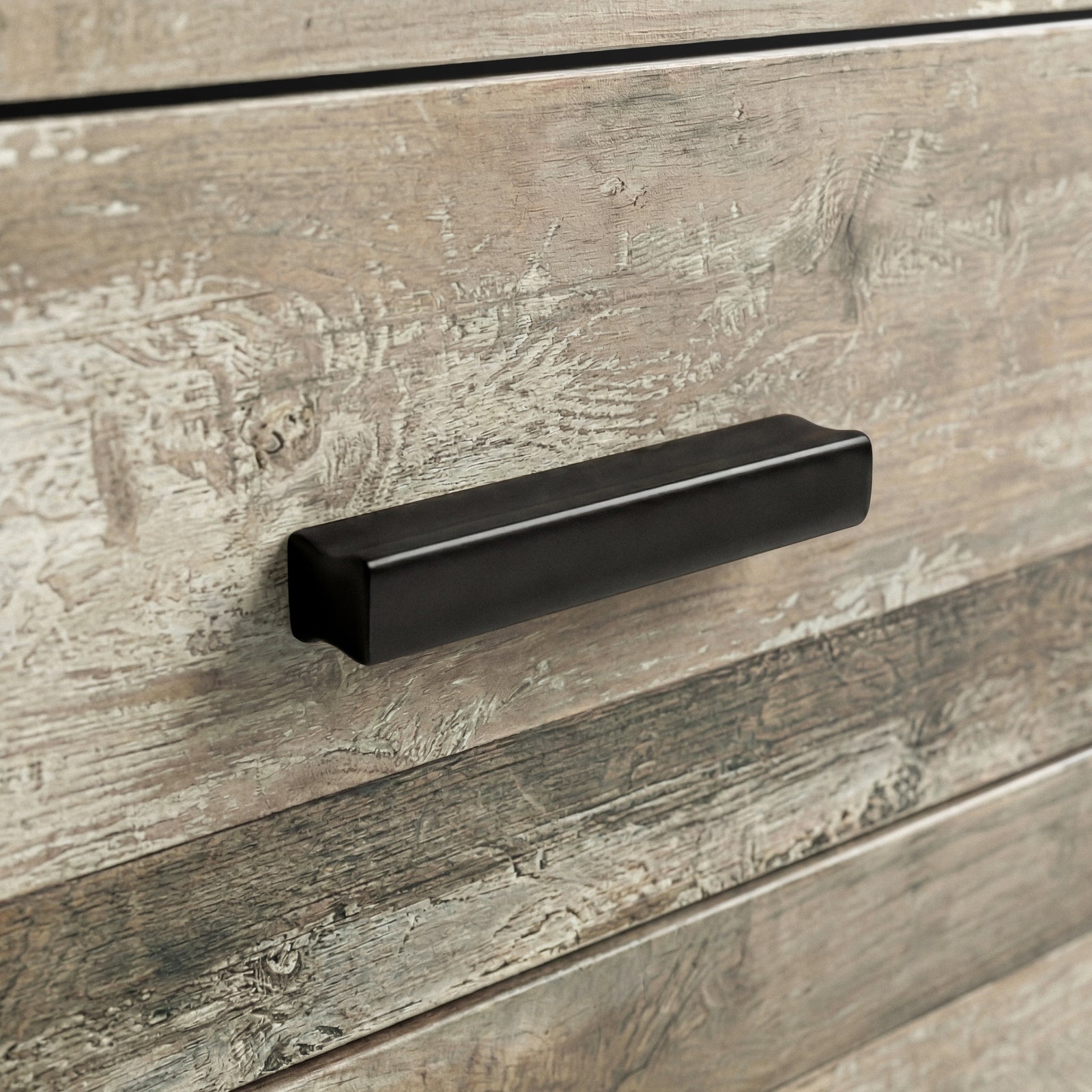 [Ash Grey] Close up of ash grey drawer front with matte black wooden handle and visible wood grain texture