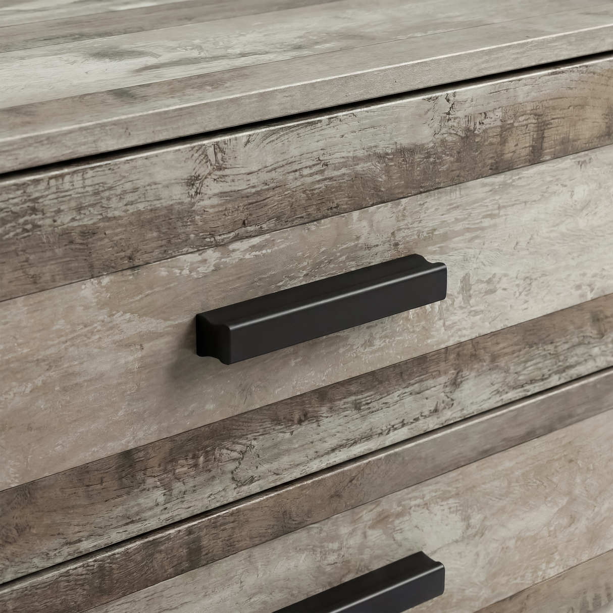 [Ash Grey] Close view of black handle mounted on ash grey drawer front with visible wood grain texture