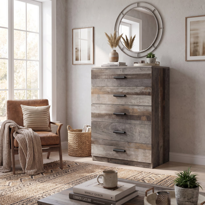 [Ash Grey] Wide lifestyle view of the Ash Grey Tall 5 Drawer Chest in a modern room setting.