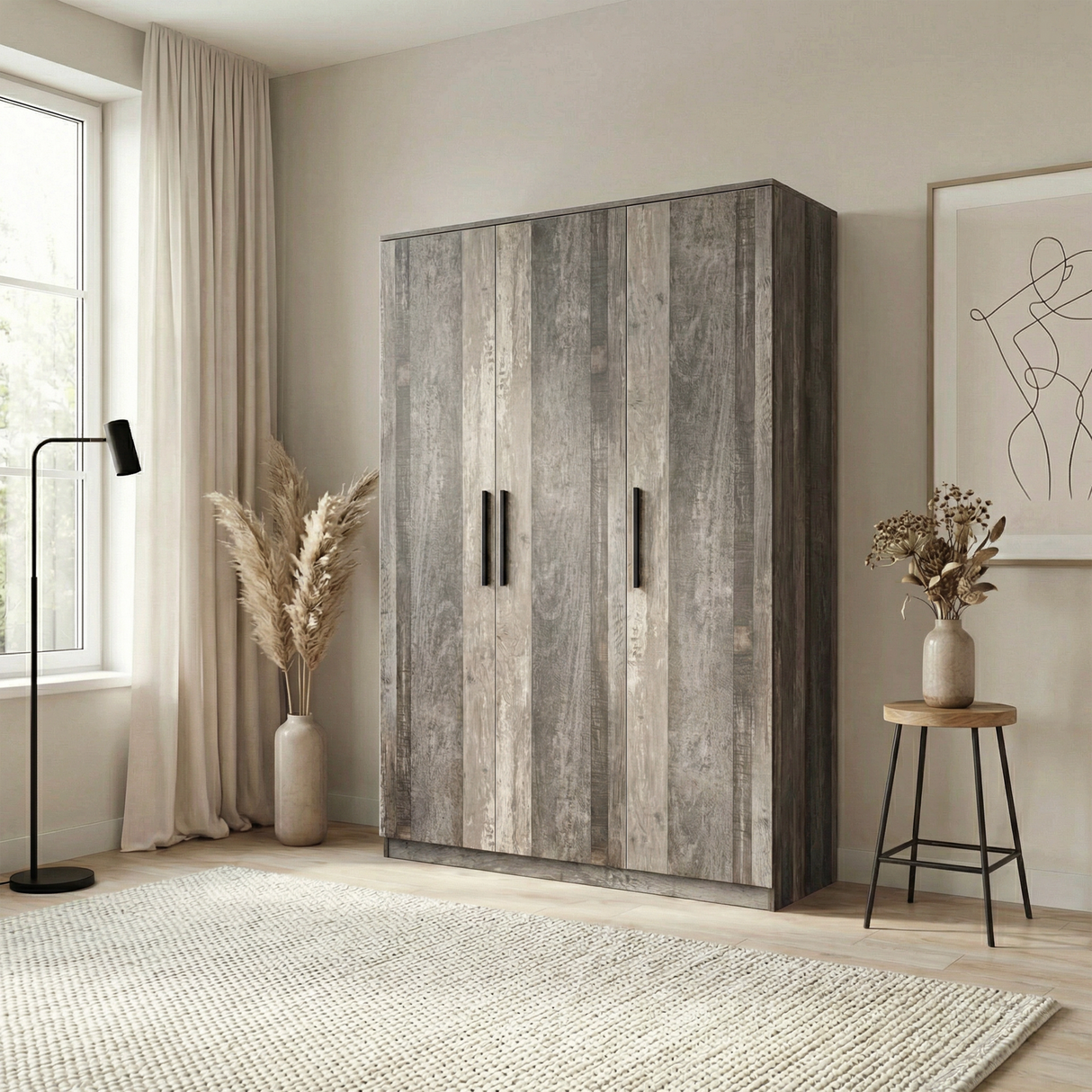 [Ash Grey] Angled bedroom view of ash grey triple door wardrobe positioned beside chair and floor lamp