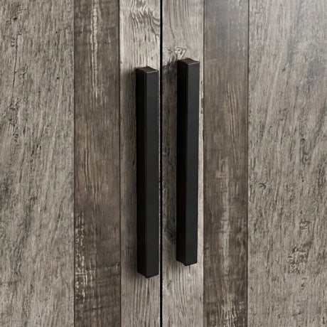 [Ash Grey] Close view of black wooden vertical handles mounted on ash grey three door plain wardrobe