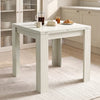 [Ash White] Closed square flip-top dining table with steel hinges, styled with a French press, mug, honey and croissant.