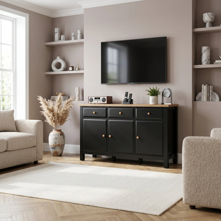 [Black] Haven Large Black Sideboard with Drawers & Oak Top, Painted Finish placed as a media console unit beneath a TV.