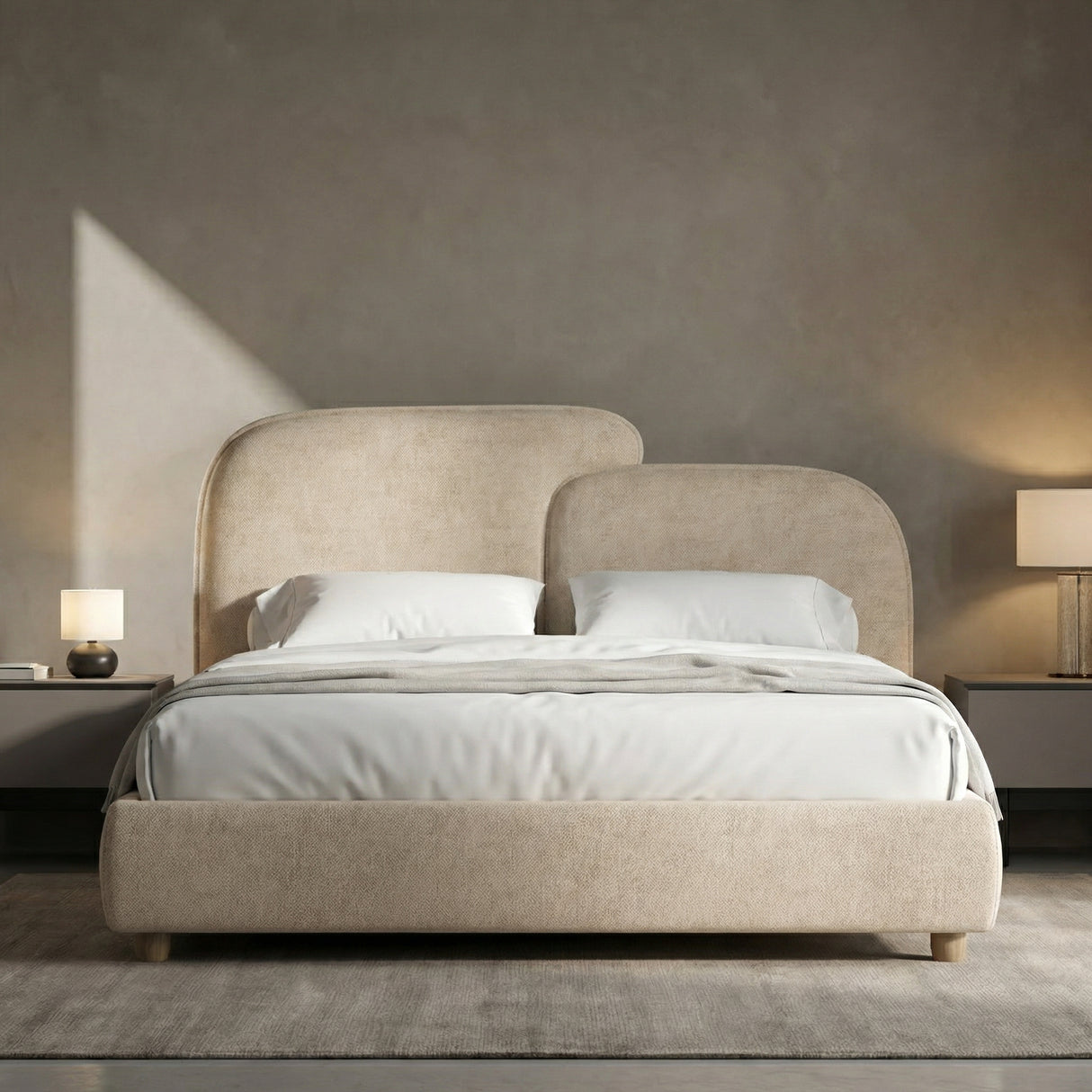 [King | Beige] upholstered bed with white bedding in a room with neutral walls and lamps.
