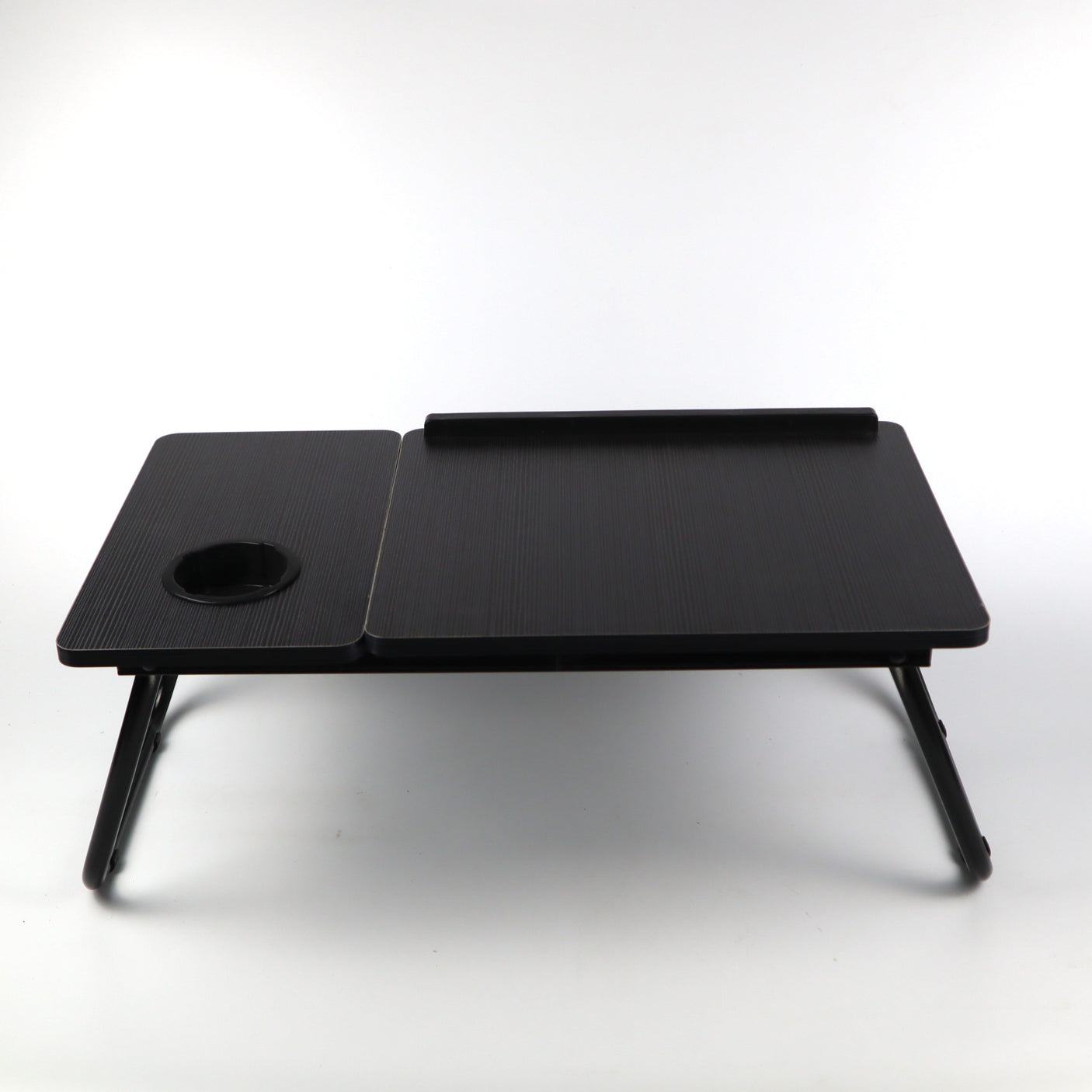 Black bed laptop tray, providing a sturdy and adjustable surface for working or using your laptop from the comfort of your bed.