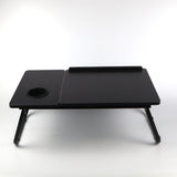 Black bed laptop tray, providing a sturdy and adjustable surface for working or using your laptop from the comfort of your bed.