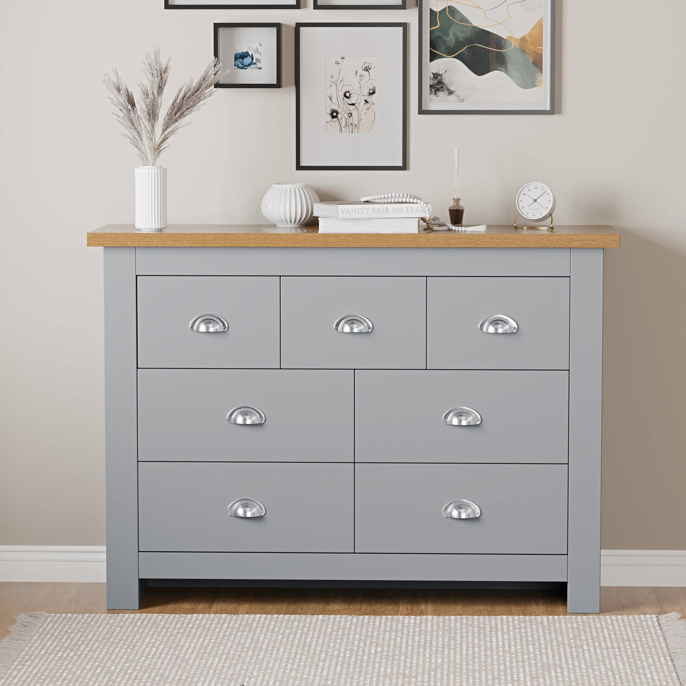 Bedroom furniture chest of drawers with top surface for flower pots, offering storage and decor.
