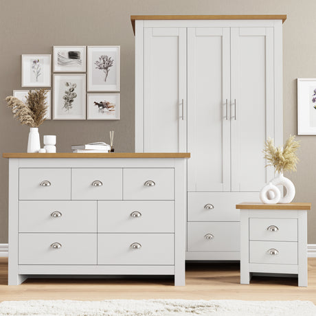 White shaker-style 3 piece bedroom furniture set with oak-effect tops, including wardrobe, drawers and table