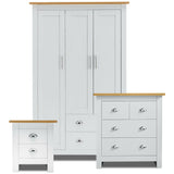 Bedroom furniture set with white wardrobe and chest of drawers, oak tops and silver handles.