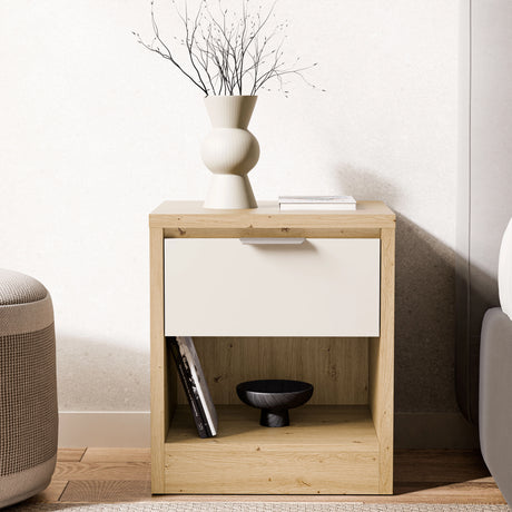 Bedside drawer placed against a wall in a contemporary room with vase and books on tabletop