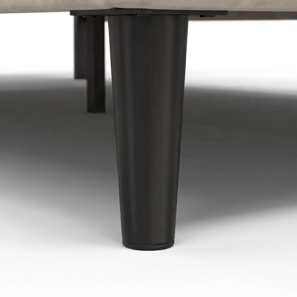 [King | Beige] Velvet bed frame close-up of dark tapered wooden leg showing base support and clearance