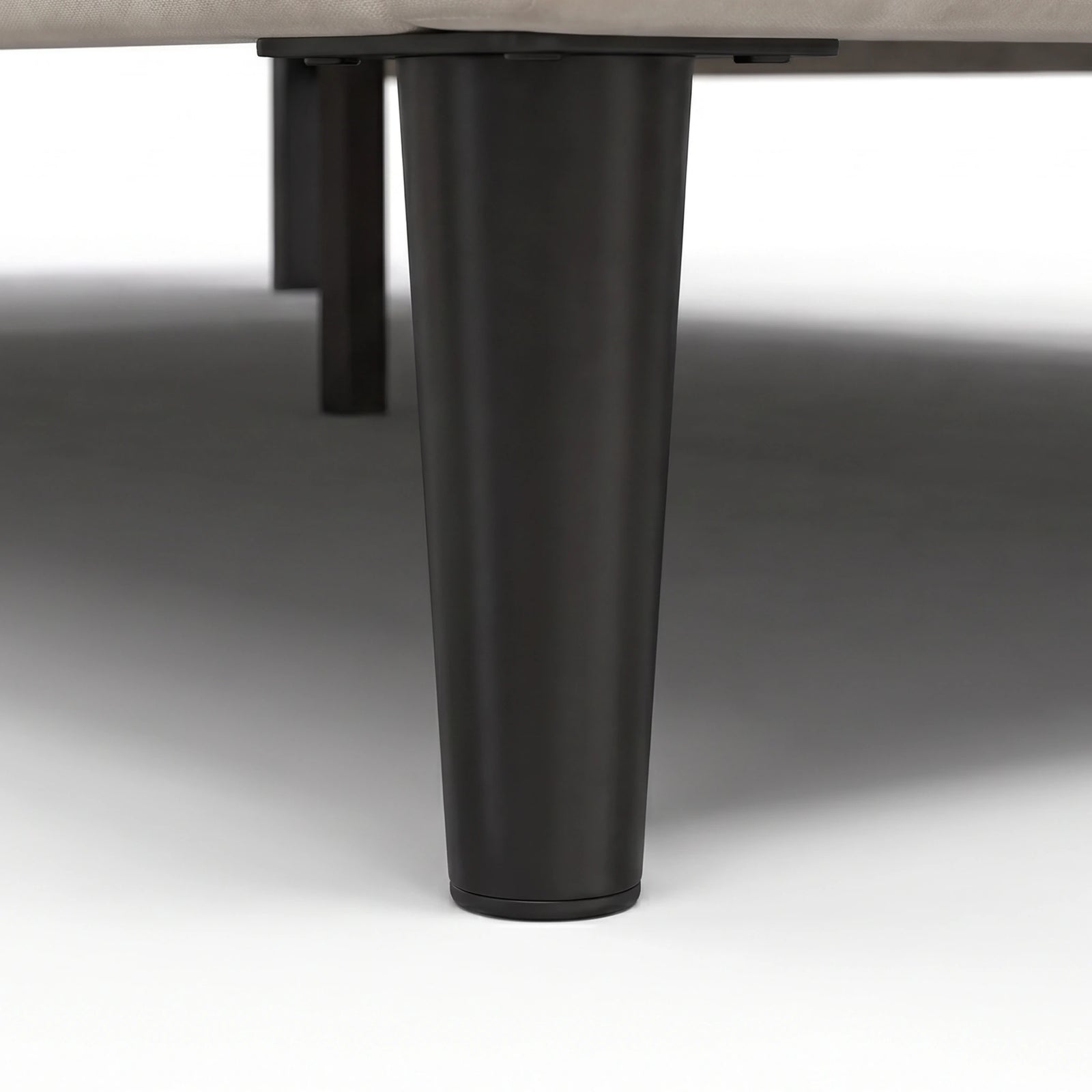 [King | Beige] Velvet bed frame close-up of dark tapered wooden leg showing base support and clearance