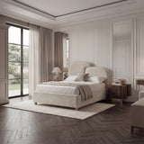 Angled perspective of beige fabric double bed highlighting rounded corners and smooth textile finish