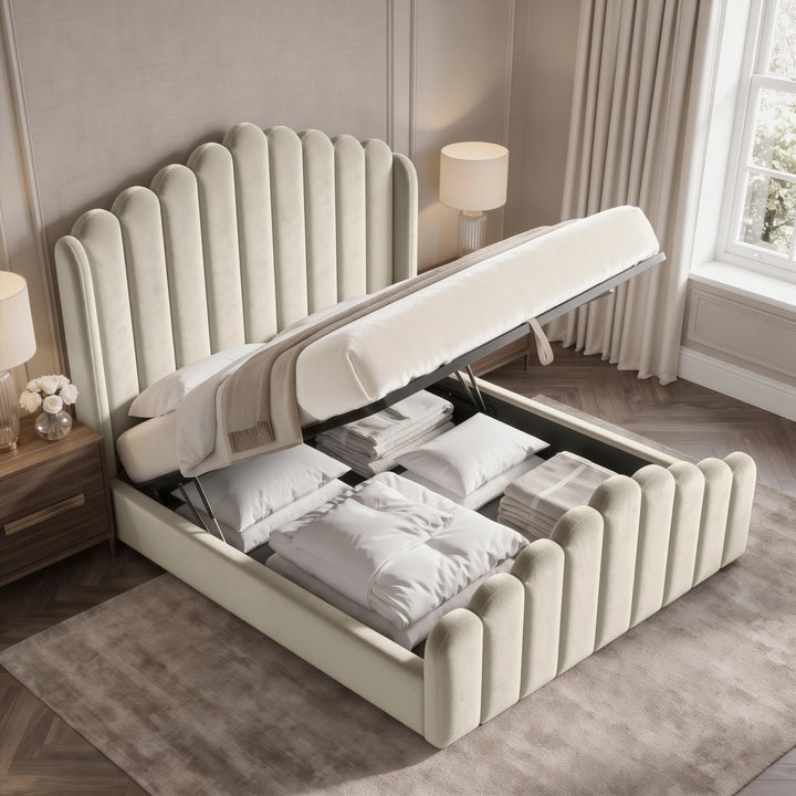 [Double | Beige] Velvet ottoman bed open from the foot end, showing gas-lift frame and full bedding storage