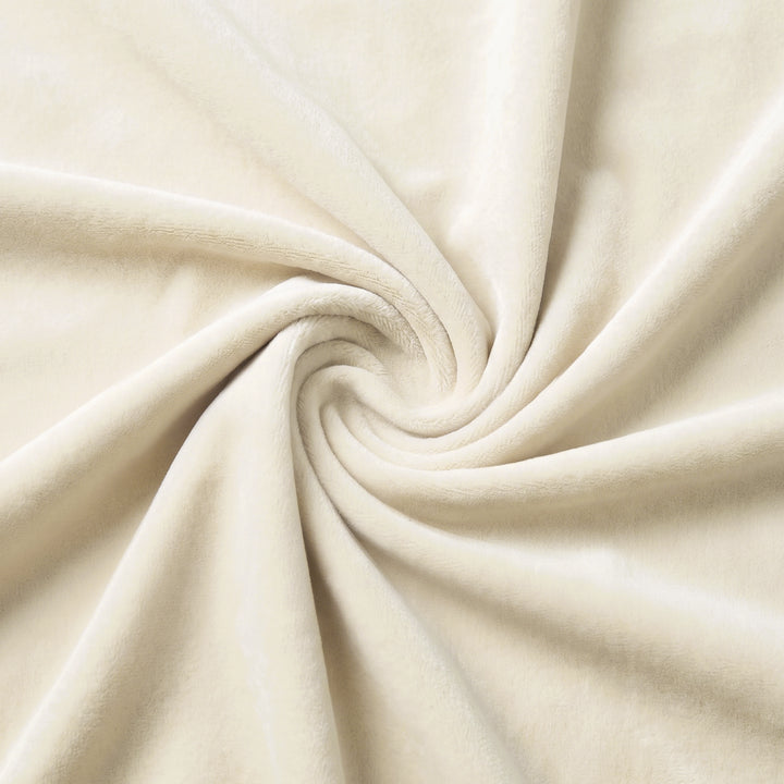 [Double | Beige] Close-up of soft cream velvet upholstery fabric swirled to show its smooth pile
