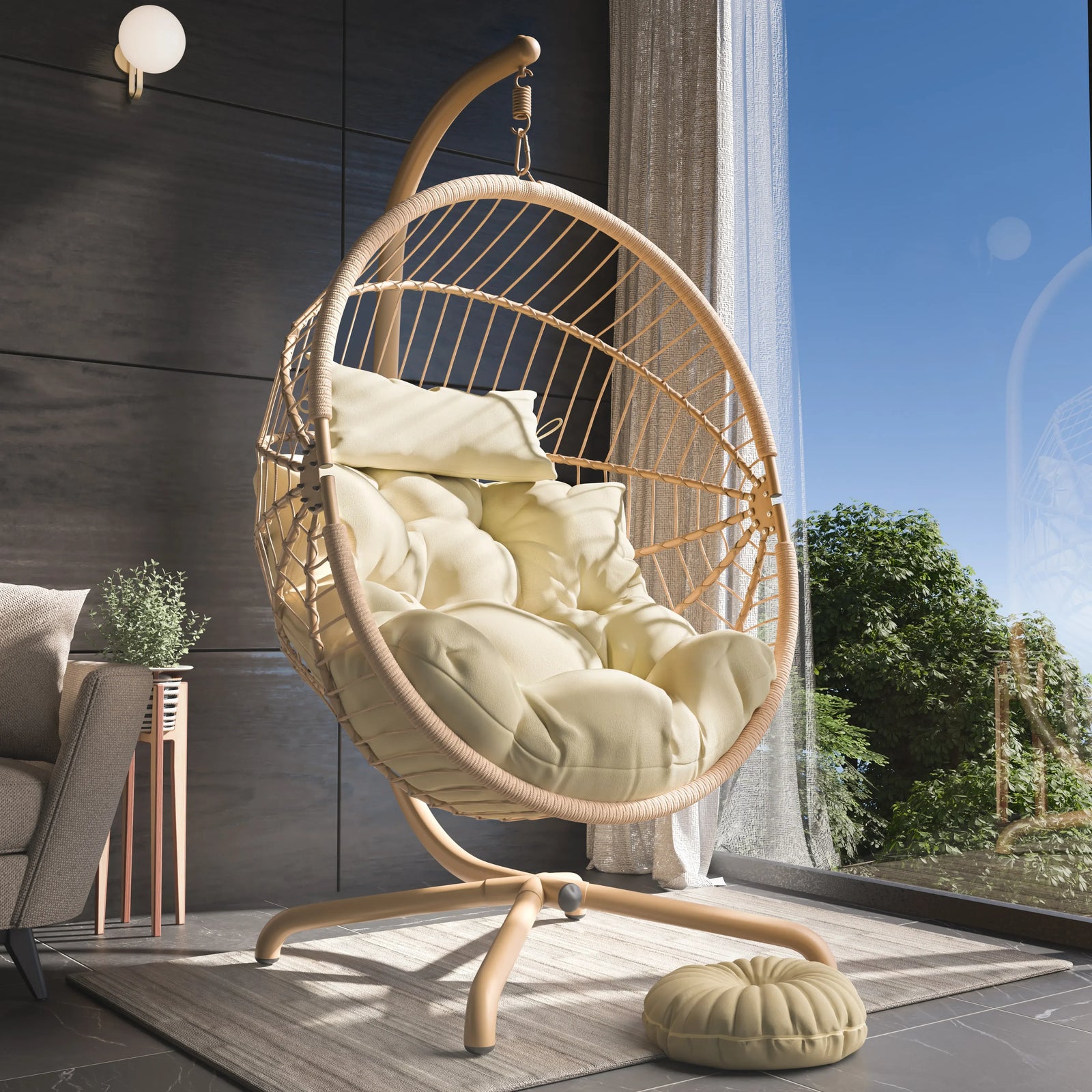 [Beige] Beige rattan hanging egg chair with cream cushions in tall-window living room with potted plant