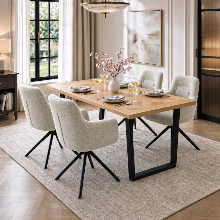 [Beige | Set of 4] Four swivel dining chairs with metal legs at a wood table set styled with plates, wine glasses and a vase.