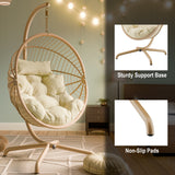 Beige hanging egg chair UK with non-slip pads and a sturdy support base for stability.