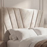 Close-up of the beige king ottoman bed’s padded headboard, highlighting its soft, tufted design