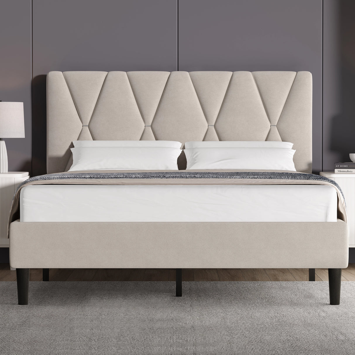 Beige upholstered bed with diamond patterned headboard in a room setting.