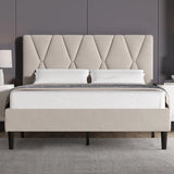 Beige upholstered bed with diamond patterned headboard in a room setting.