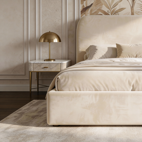 Front footboard view of beige velvet king ottoman bed showing low upholstered base and smooth fabric finish