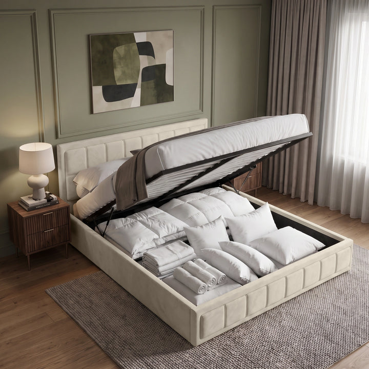 [Super King | Beige] An upholstered bed frame in a beige or off-white fabric, styled with white bedding, pillows, and a beige throw blanket in a modern bedroom setting.